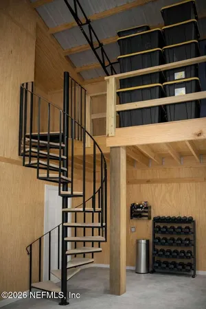 a living room with furniture a rug and a table