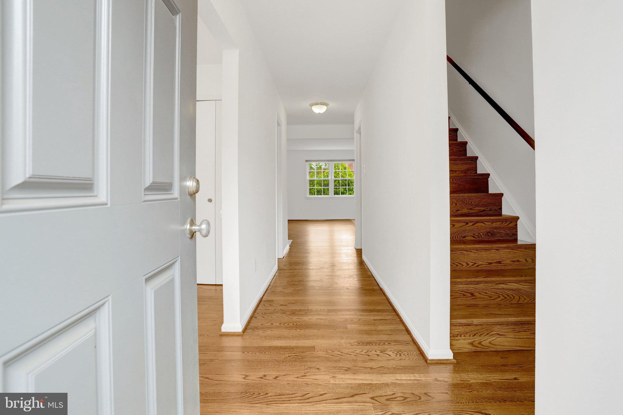 2225 North Tuckahoe Street Arlington, VA 22205 - Photo 3 of 37 a view of a hallway with wooden floor and staircase