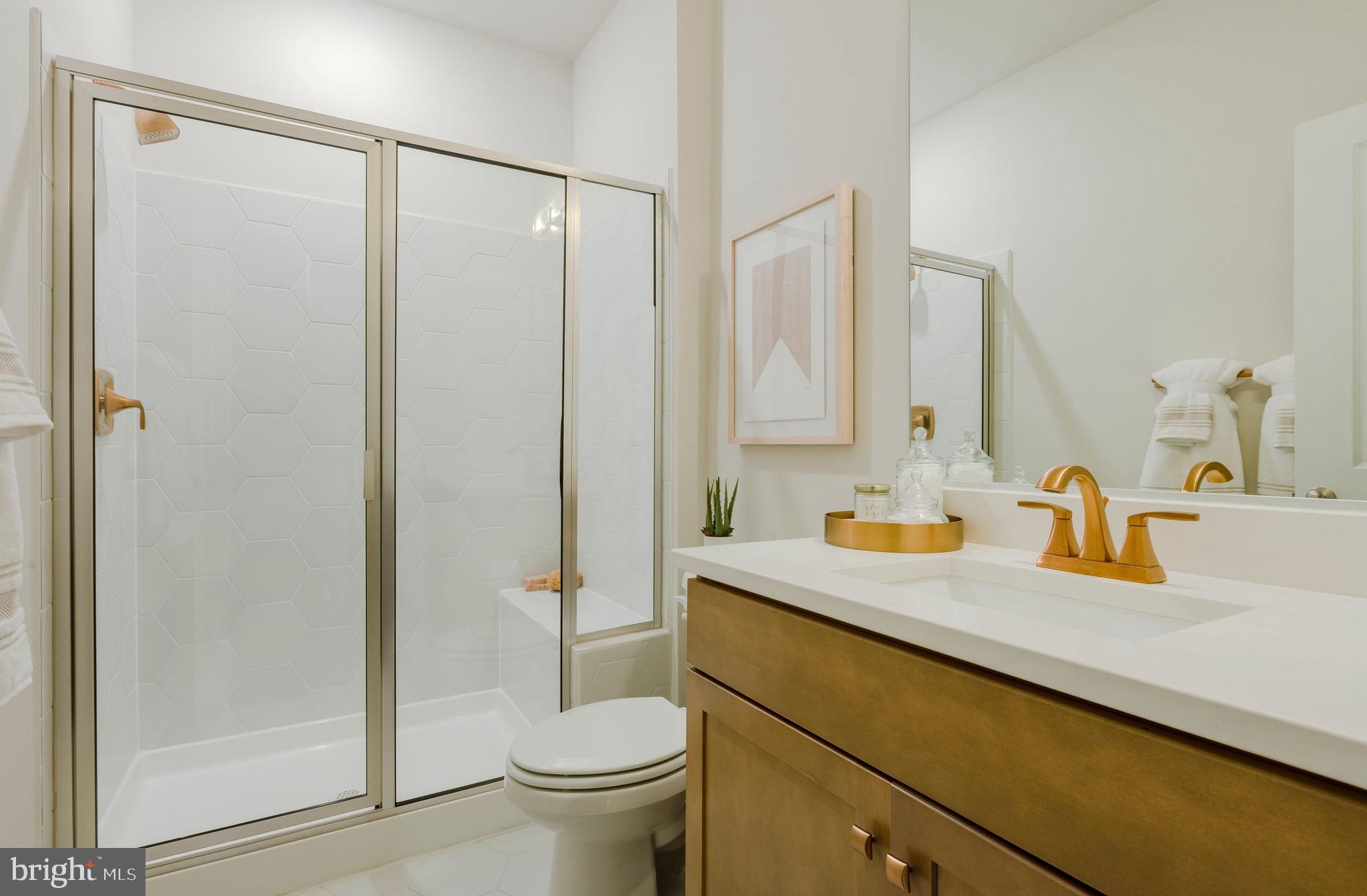 12109 Spirit Avenue Laurel, MD 20708 - Photo 19 of 33 a bathroom with a sink a toilet and shower