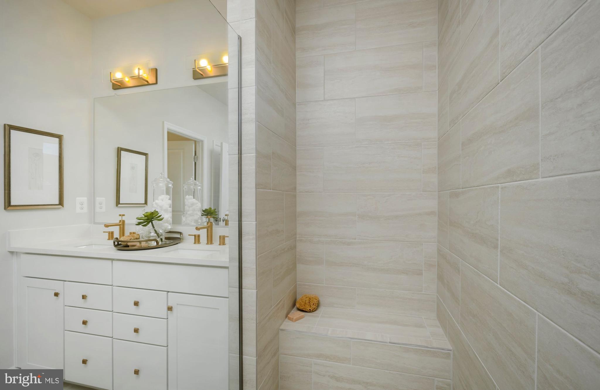 12109 Spirit Avenue Laurel, MD 20708 - Photo 25 of 33 a bathroom with a granite countertop sink and a mirror