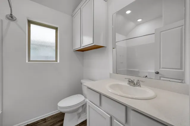 a white bath tub sitting next to a shower