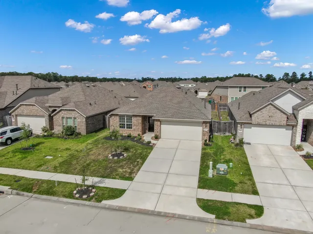 a aerial view of a house with a yard
