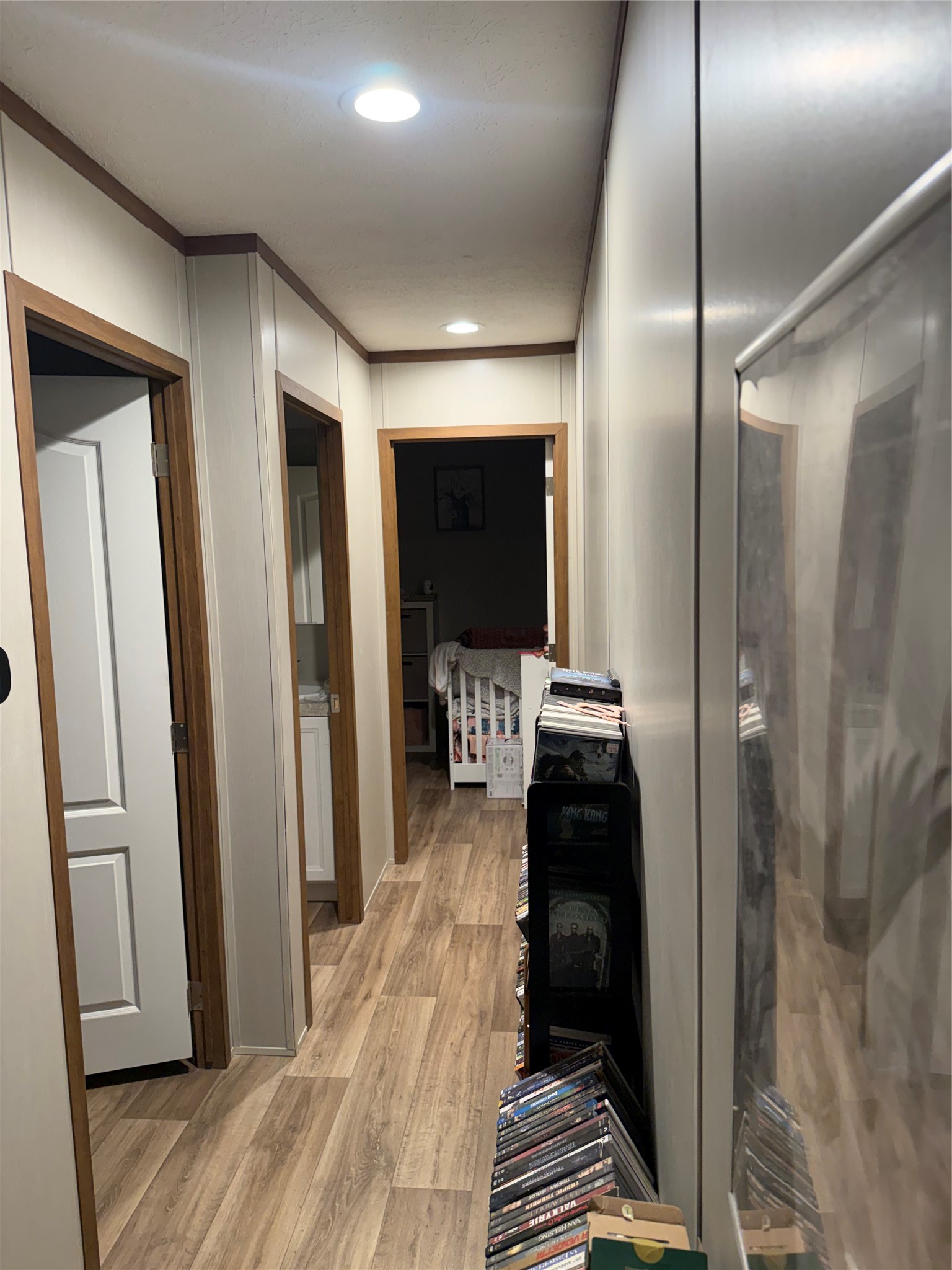 12856 Dodd Road Splendora, TX 77372 - Photo 4 of 6 a view of a hallway with wooden floor and windows