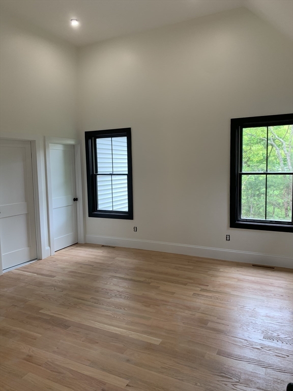 3 Baker Street Norton, MA 02766 - Photo 15 of 26 a view of an empty room with a window and wooden floor