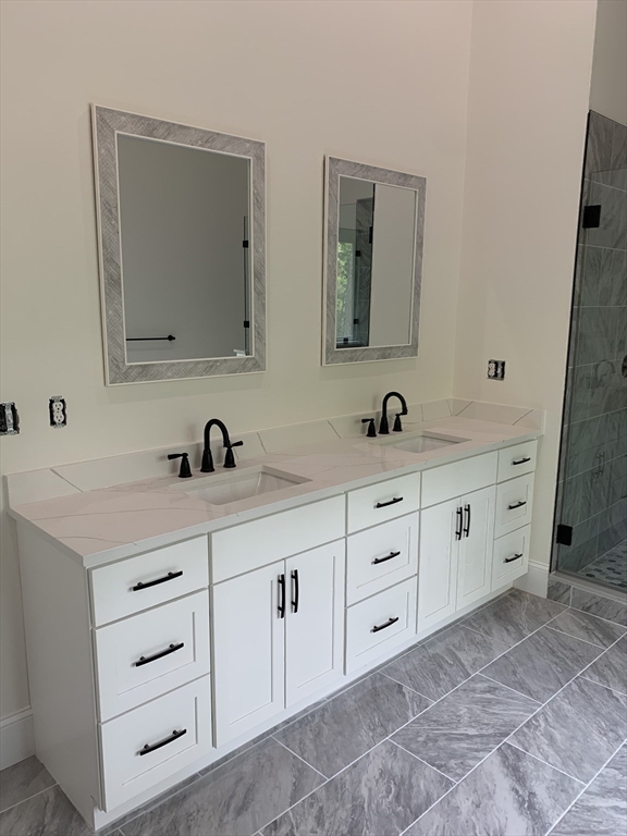3 Baker Street Norton, MA 02766 - Photo 18 of 26 a bathroom with double sink and a mirror
