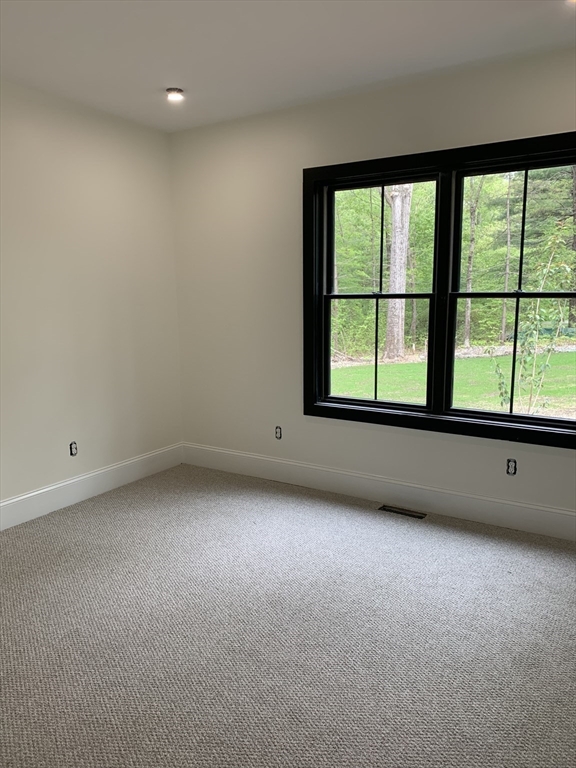 3 Baker Street Norton, MA 02766 - Photo 25 of 26 a view of an empty room with a window