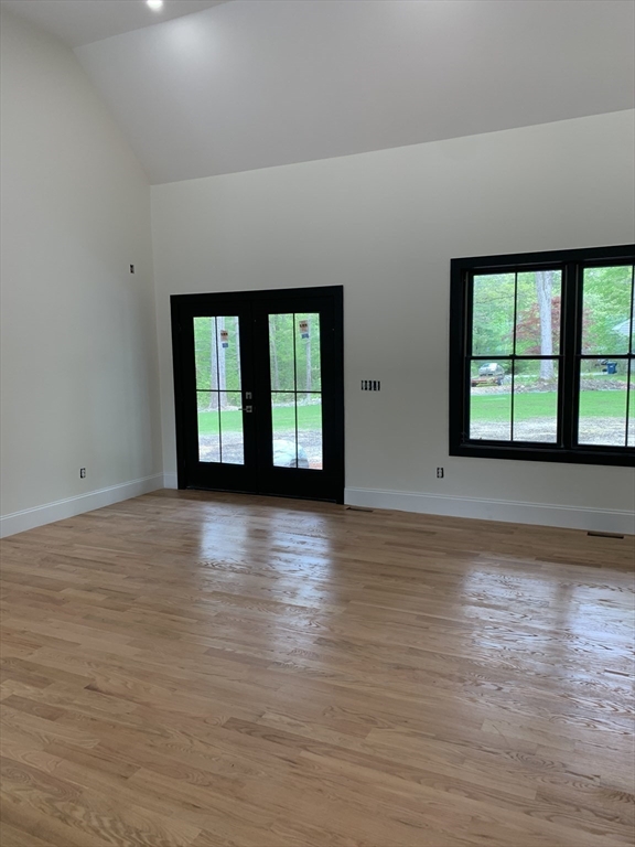 3 Baker Street Norton, MA 02766 - Photo 10 of 26 a view of an empty room with wooden floor and a window