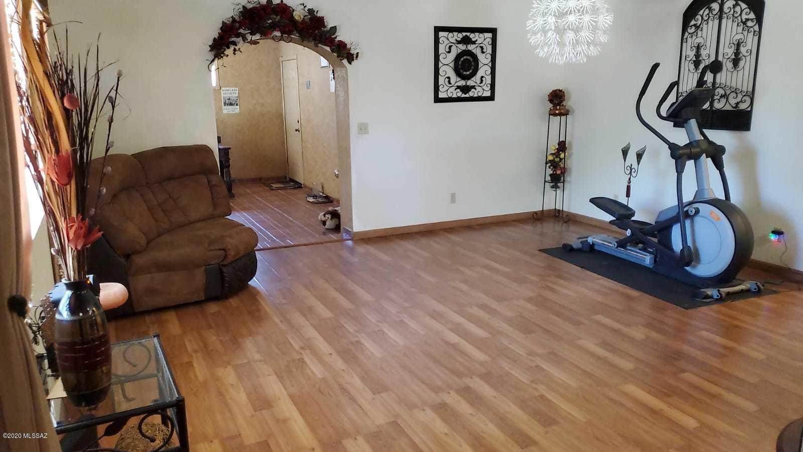 173 Nabo Court Rio Rico, AZ 85648 - Photo 16 of 26 a view of livingroom with furniture and a chandelier
