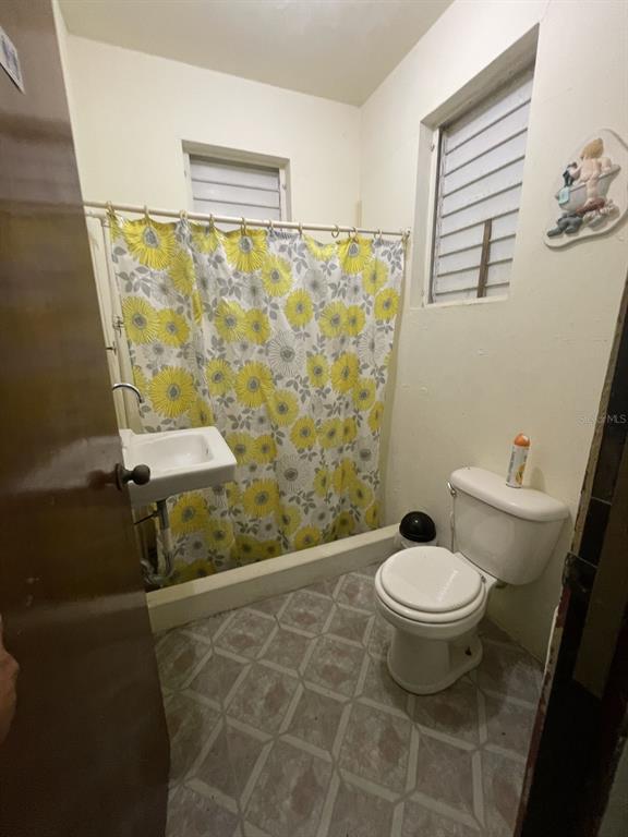 Camino Entrada Alley Lago, PR 00926 - Photo 12 of 82 a bathroom with a sink toilet and shower