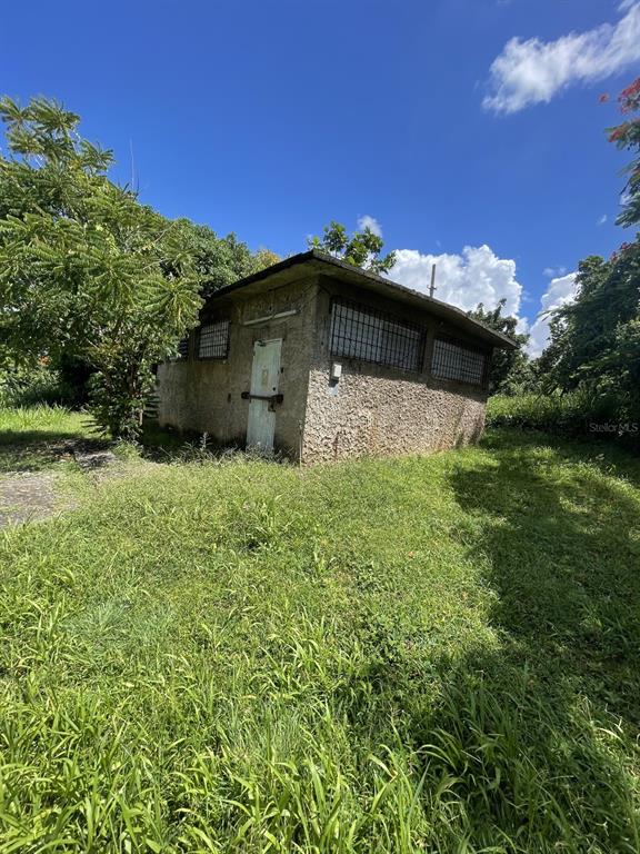 Camino Entrada Alley Lago, PR 00926 - Photo 7 of 82 a front view of a house with a yard