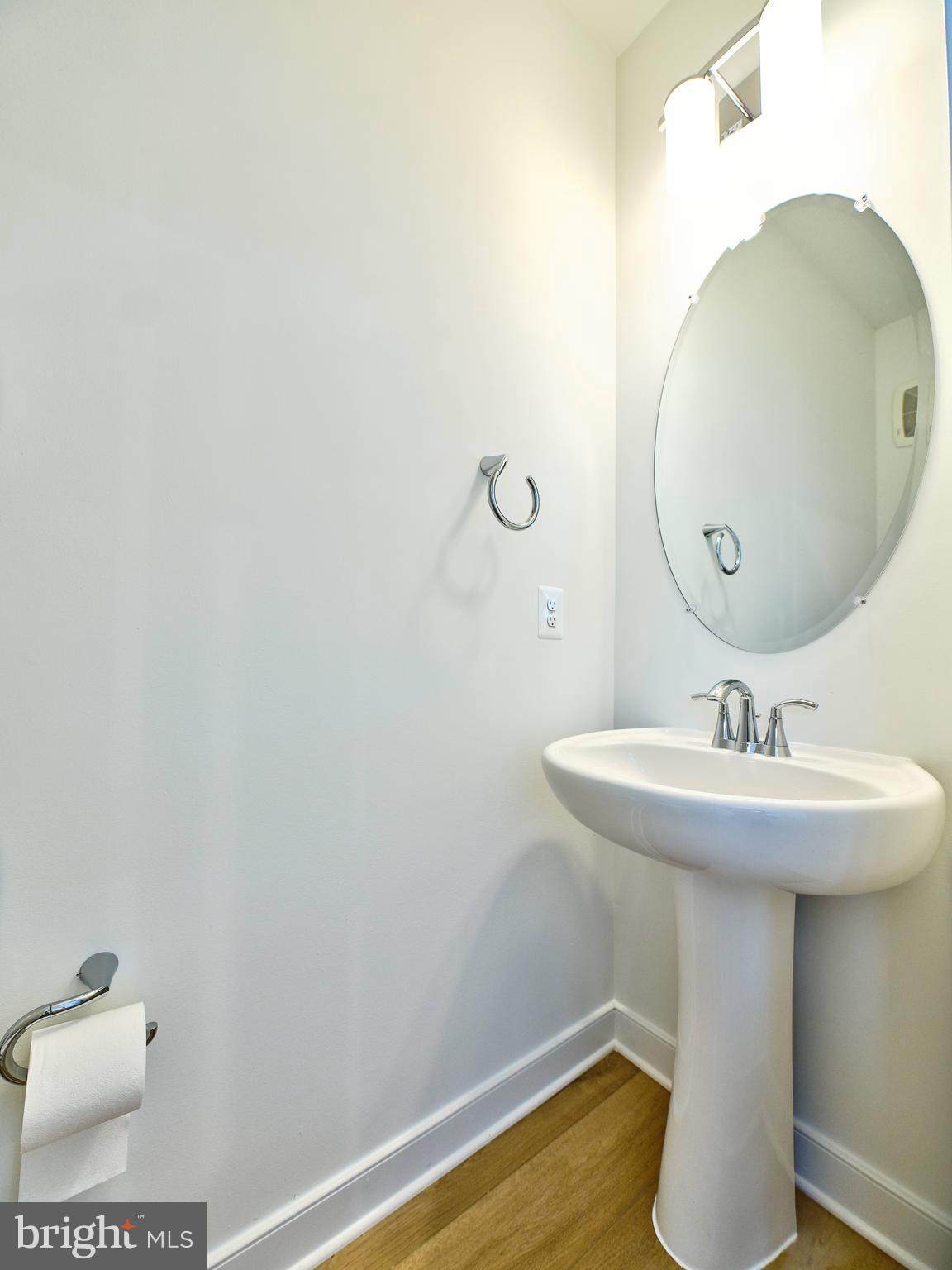 16076 Frederick Road Rockville, MD 20850 - Photo 12 of 30 a bathroom with a sink and mirror