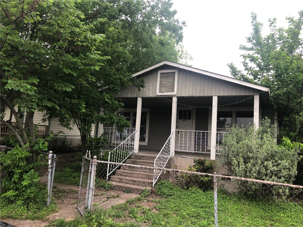a house with trees in the background