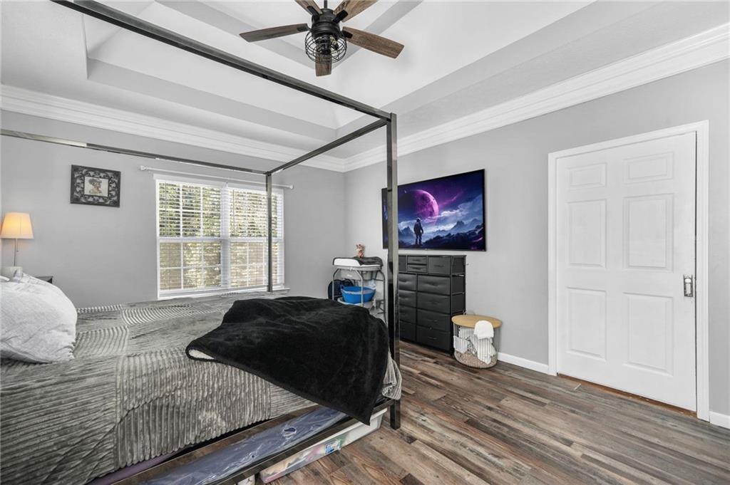 4835 Liberty Road Villa Rica, GA 30180 - Photo 21 of 69 a bedroom with a bed and wooden floor