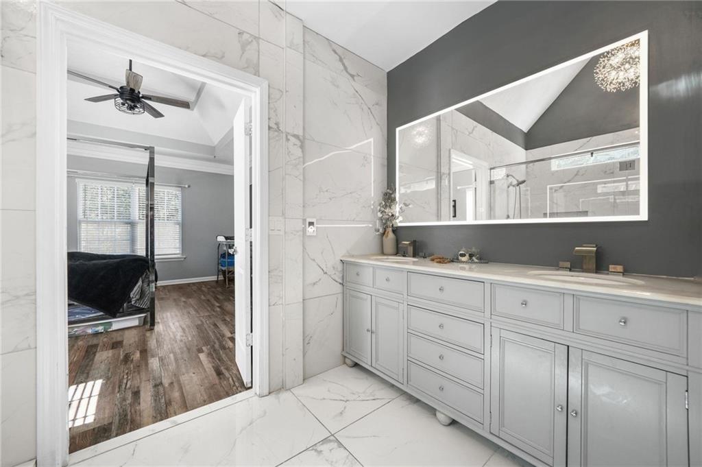 4835 Liberty Road Villa Rica, GA 30180 - Photo 24 of 69 a spacious bathroom with a double vanity sink and a mirror