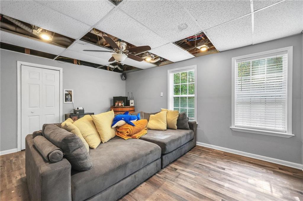 4835 Liberty Road Villa Rica, GA 30180 - Photo 39 of 69 a living room with furniture a ceiling fan and a window