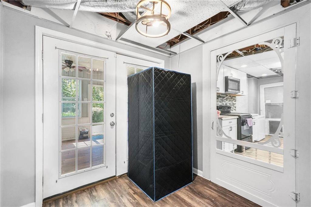 4835 Liberty Road Villa Rica, GA 30180 - Photo 50 of 69 a view of a hallway with wooden floor and a kitchen