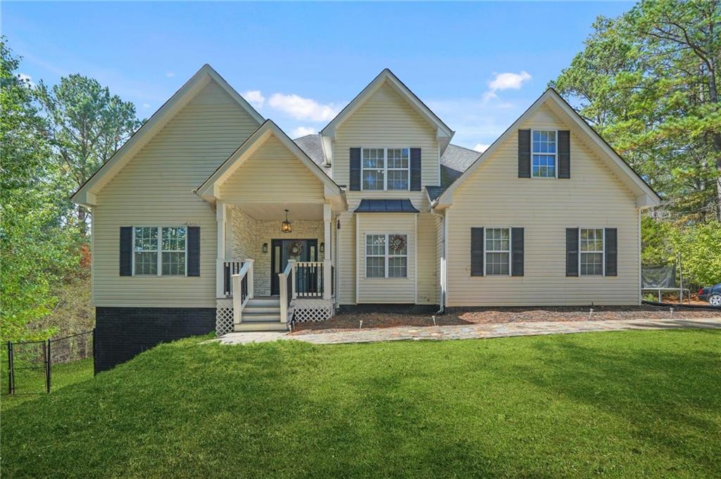 4835 Liberty Road Villa Rica, GA 30180 - Photo 5 of 69 a front view of a house with a yard