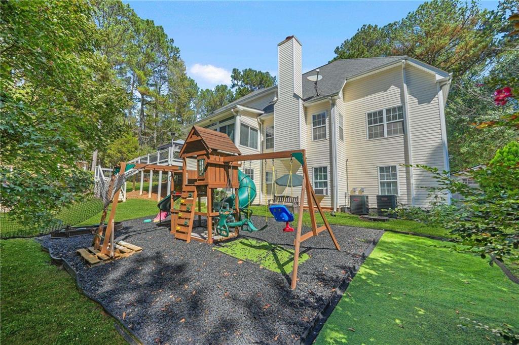 4835 Liberty Road Villa Rica, GA 30180 - Photo 56 of 69 a front view of a house with a yard and potted plants