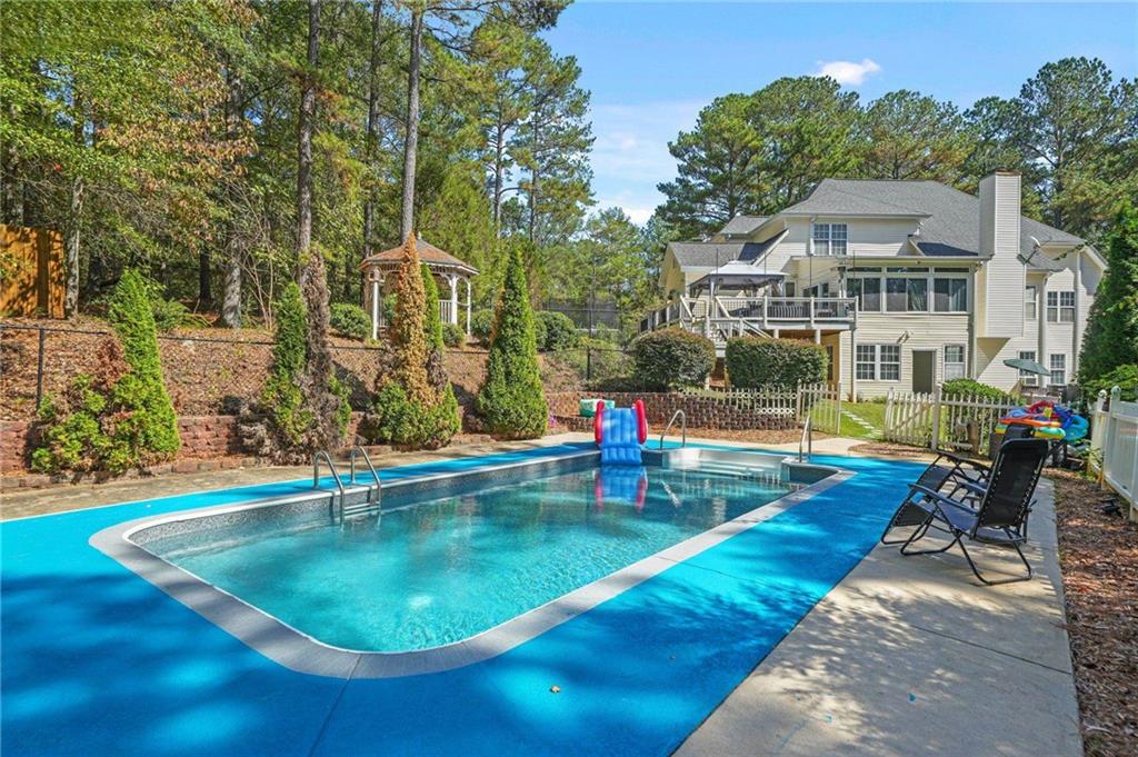 4835 Liberty Road Villa Rica, GA 30180 - Photo 6 of 69 swimming pool view with a outdoor seating