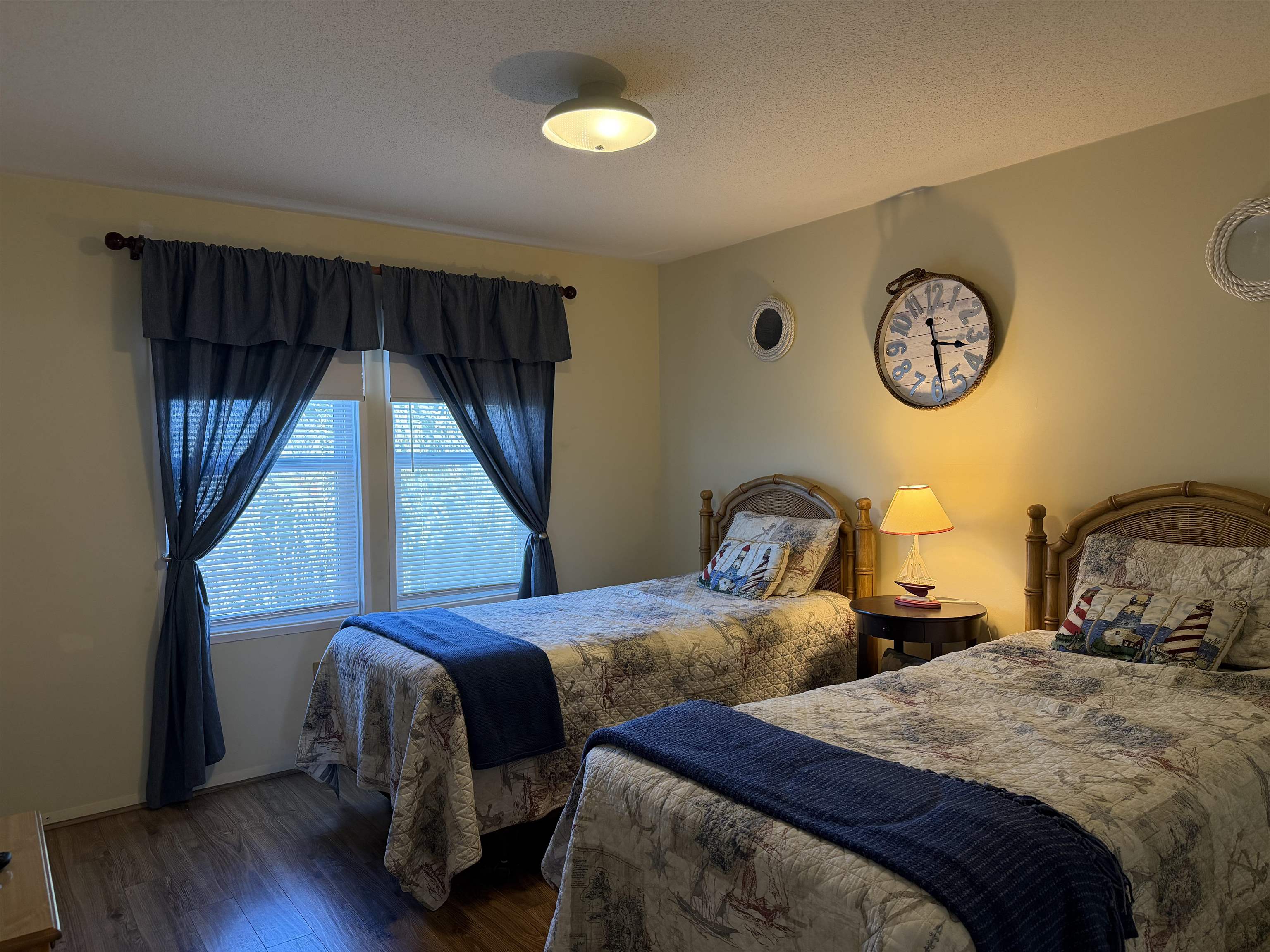 1980 Lark Surfside Beach, SC 29575 - Photo 16 of 30 Bedroom with a textured ceiling and wood finished floors