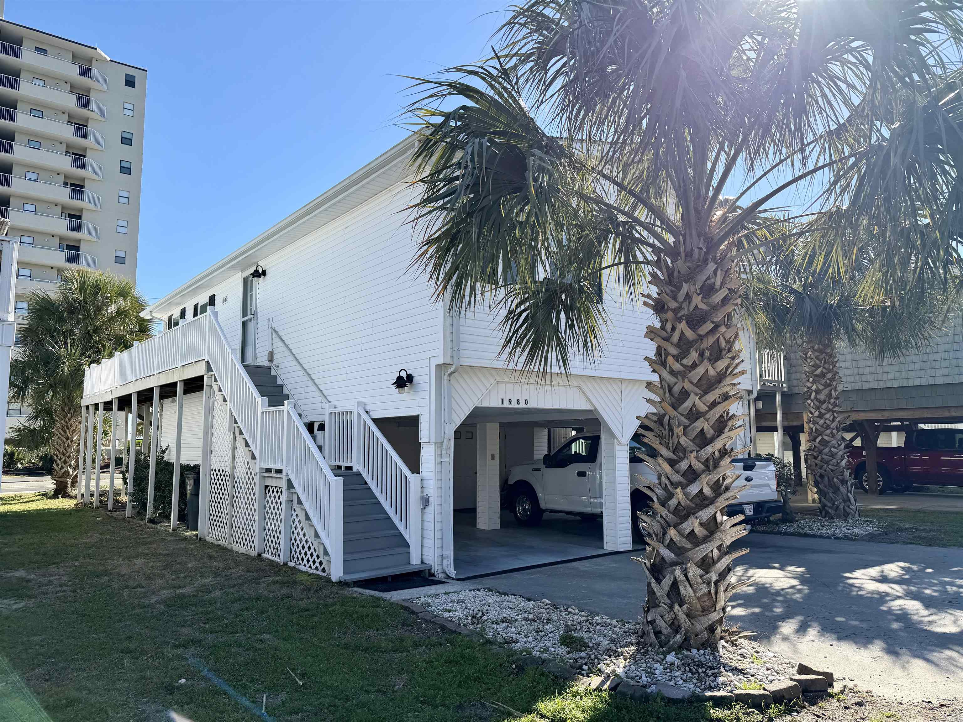1980 Lark Surfside Beach, SC 29575 - Photo 21 of 30 Garage with a carport and driveway