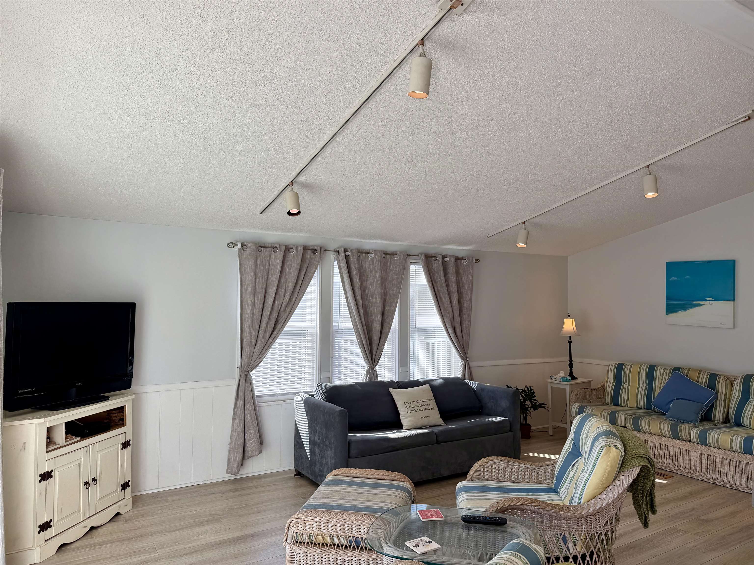 1980 Lark Surfside Beach, SC 29575 - Photo 8 of 30 Living area with a wainscoted wall, a textured ceiling, track lighting, and light wood-style flooring