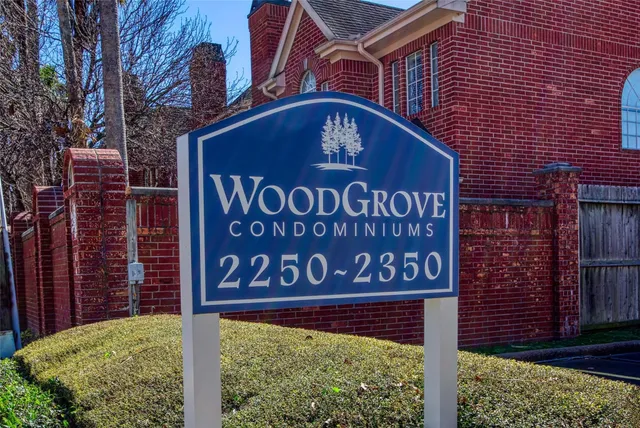 a sign on the brick wall