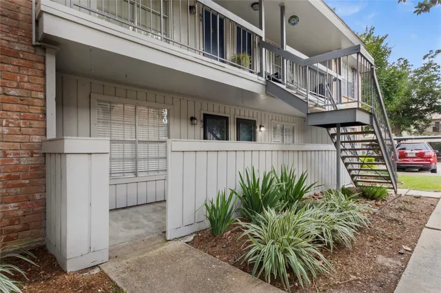 front view of a house with potted plants