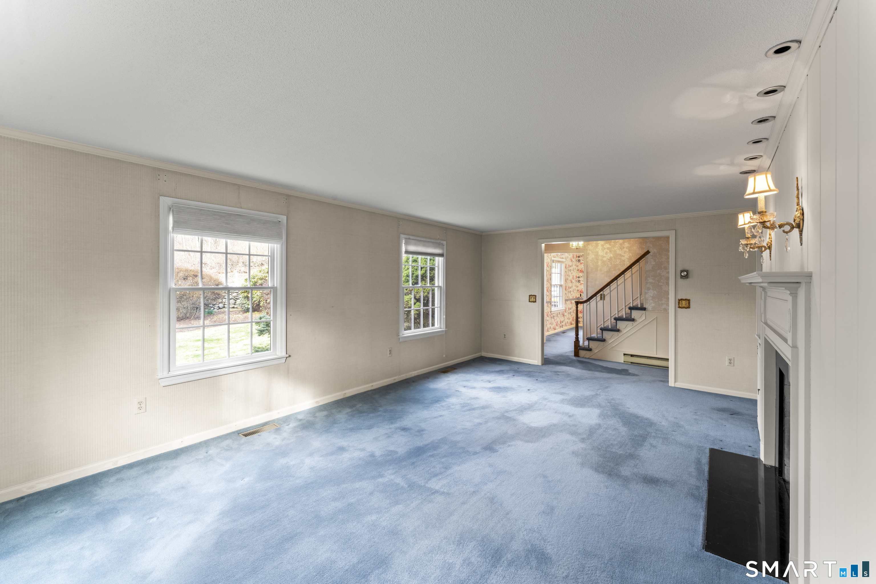 30 Currituck Road Newtown, CT 06470 - Photo 13 of 38 an empty room with windows and fireplace