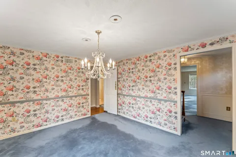 a bathroom with a sink toilet and mirror