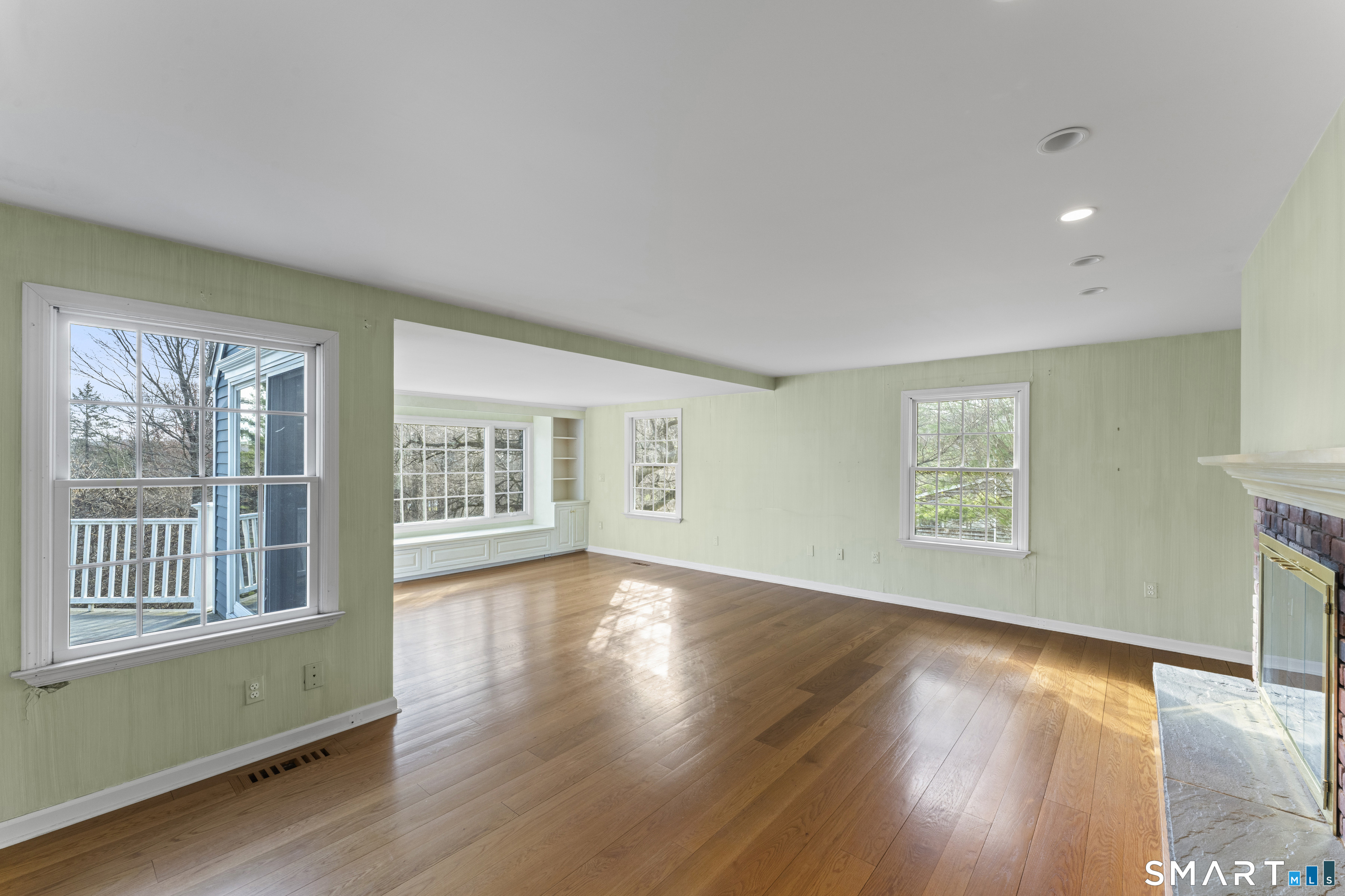 30 Currituck Road Newtown, CT 06470 - Photo 18 of 38 a view of an empty room with wooden floor and a window