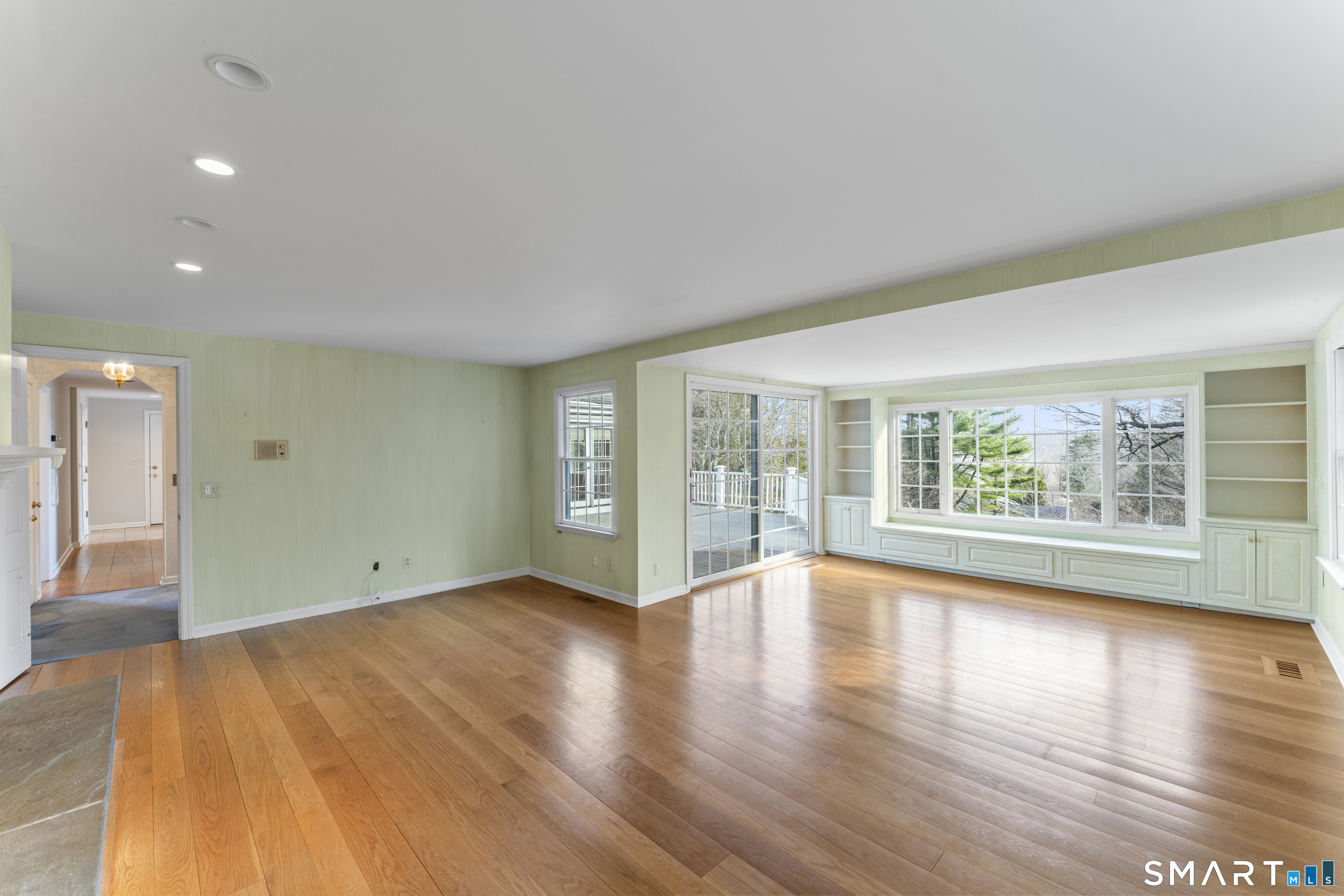 30 Currituck Road Newtown, CT 06470 - Photo 21 of 38 a view of an empty room with wooden floor and a window