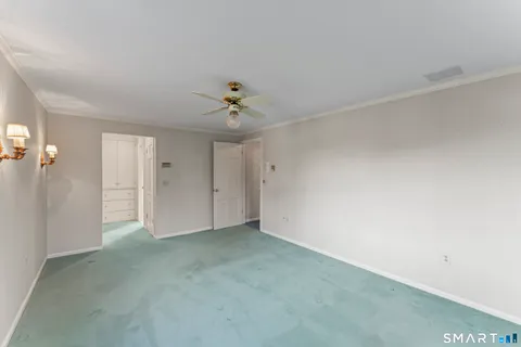 an empty room with windows and closet