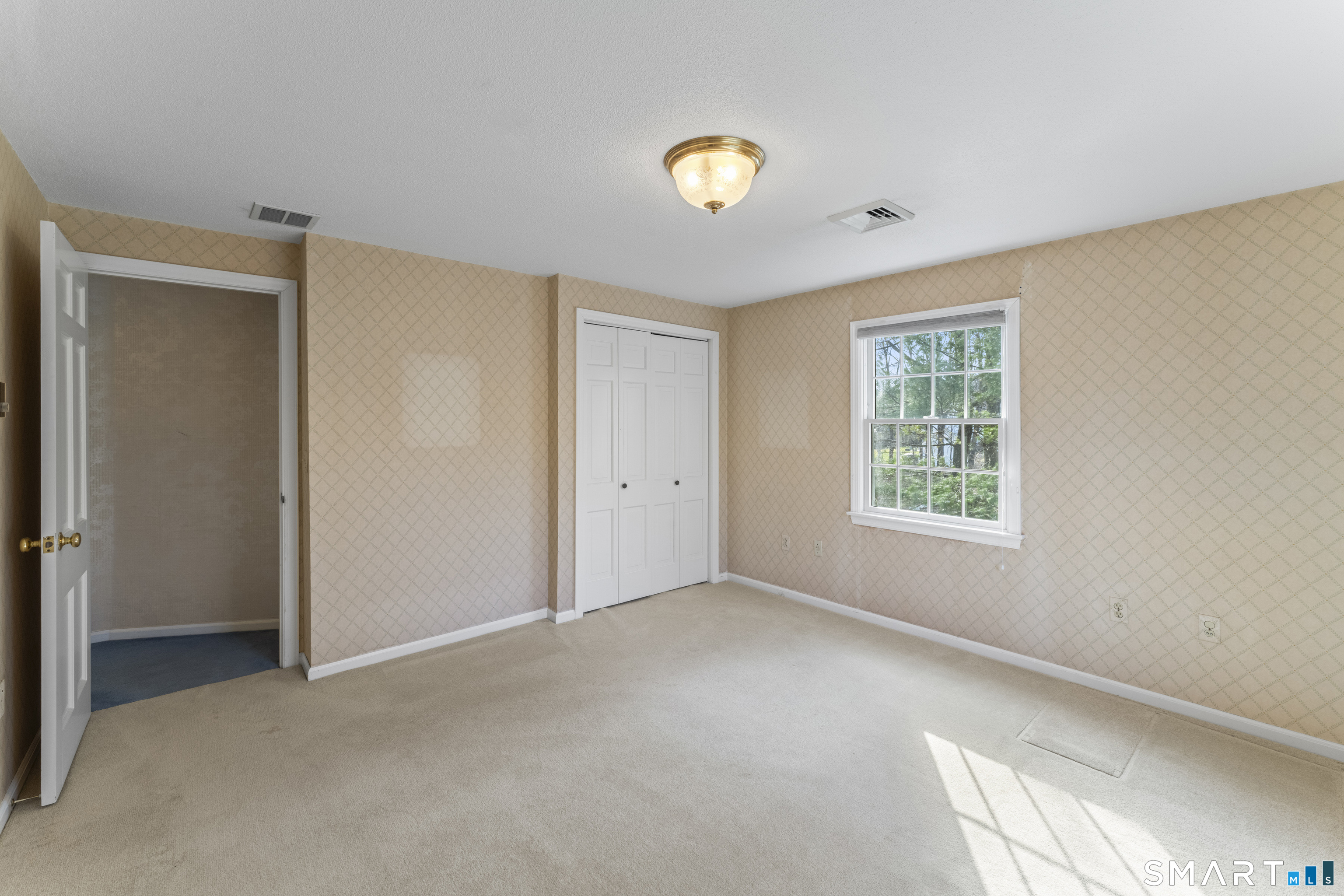 30 Currituck Road Newtown, CT 06470 - Photo 34 of 38 a view of an empty room with a window