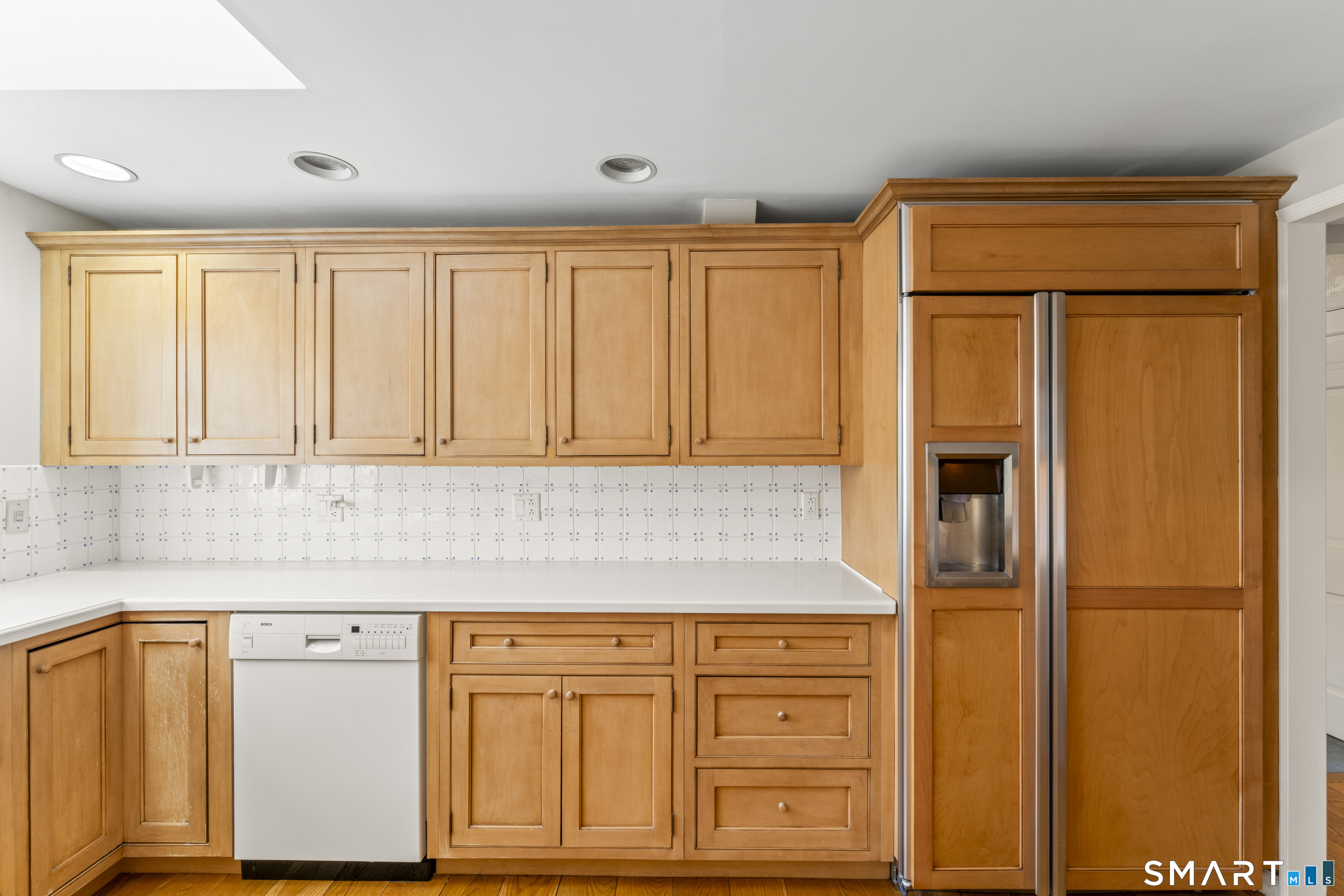 30 Currituck Road Newtown, CT 06470 - Photo 4 of 38 a kitchen with granite countertop cabinets and black stainless steel appliances