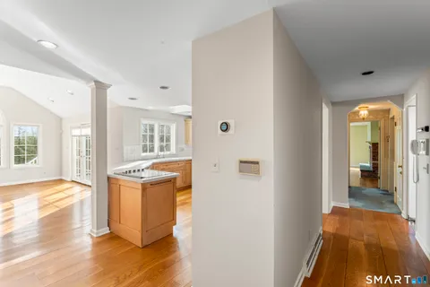 a view of living room with a sink and wooden floor