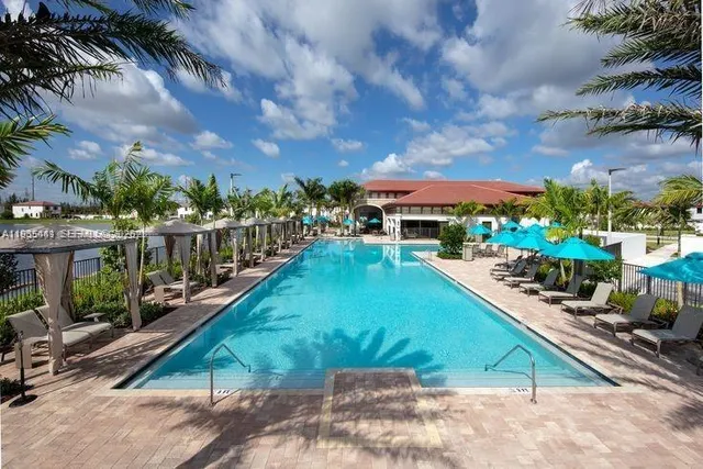 a view of a swimming pool with a patio