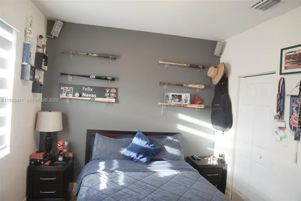 a living room with a flat screen tv and a fireplace