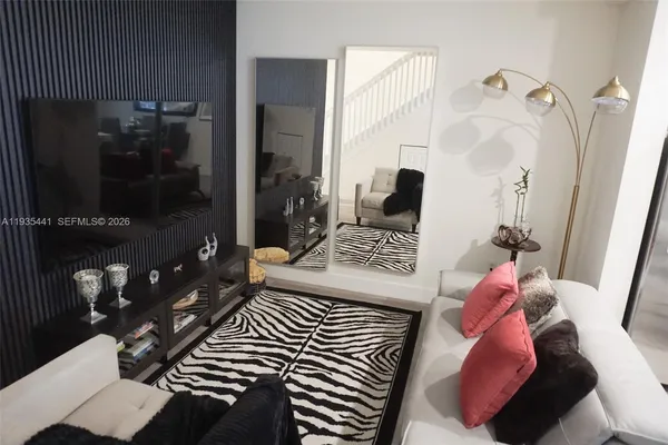 a bedroom with a bed and a mirror