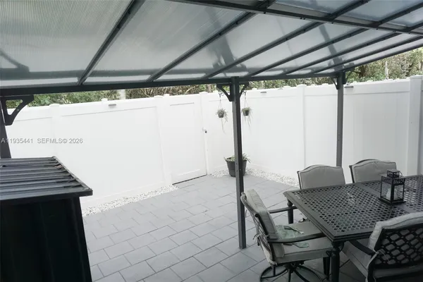 a view of entryway with workspace and window