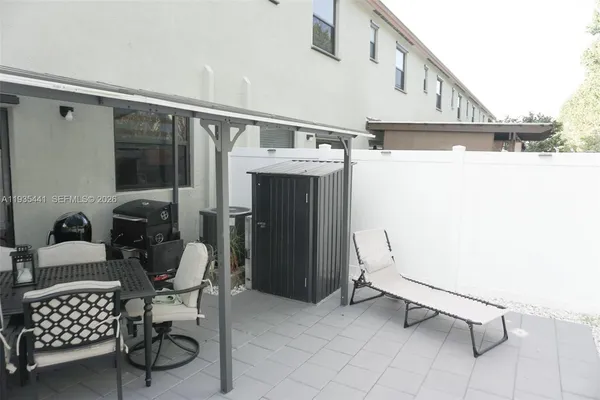 a view of balcony with furniture