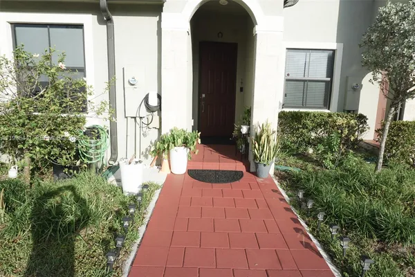 a view of a backyard of the house