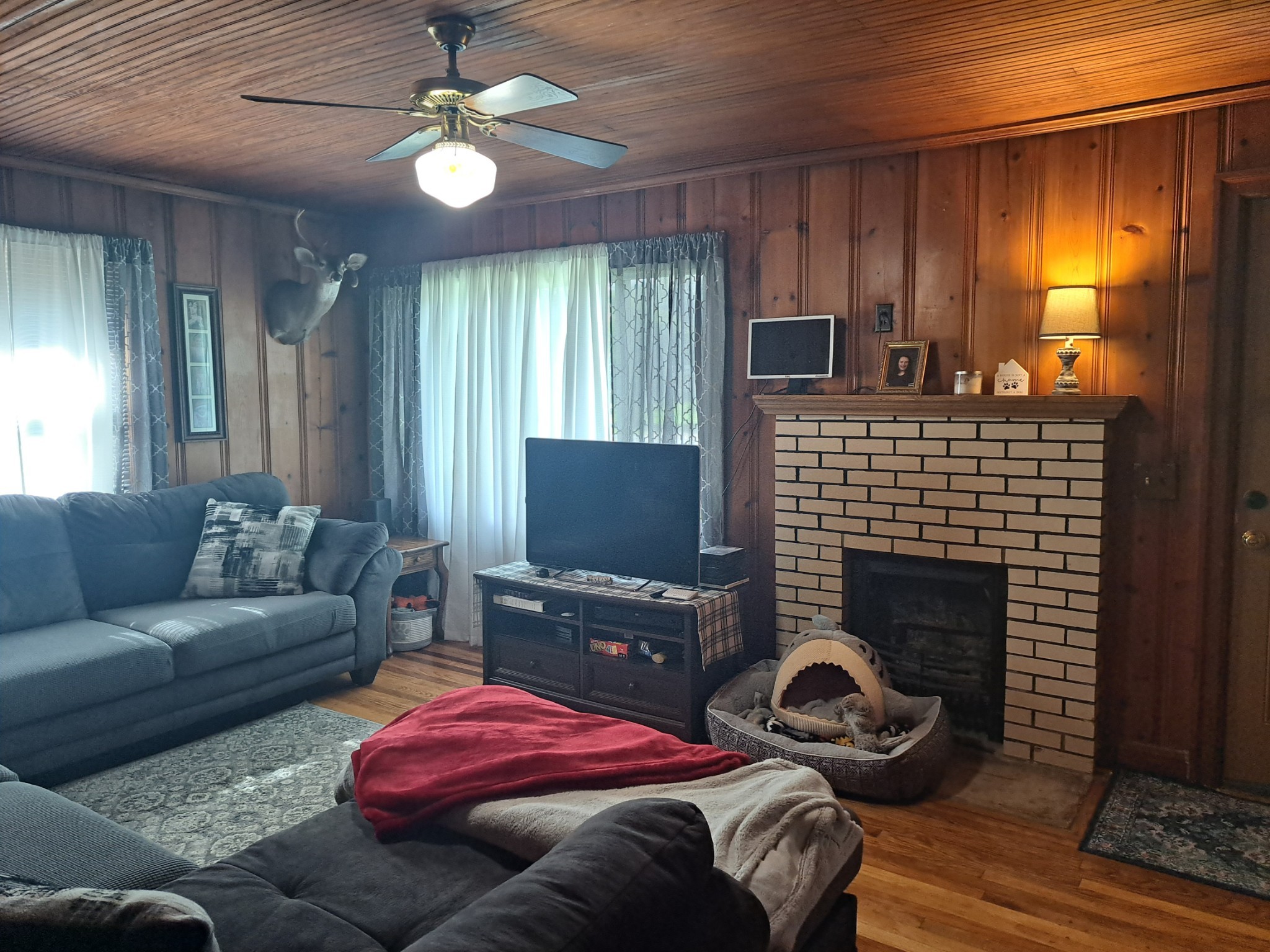 808 Days Road Lafayette, TN 37083 - Photo 8 of 18 a living room with furniture a fireplace and a flat screen tv