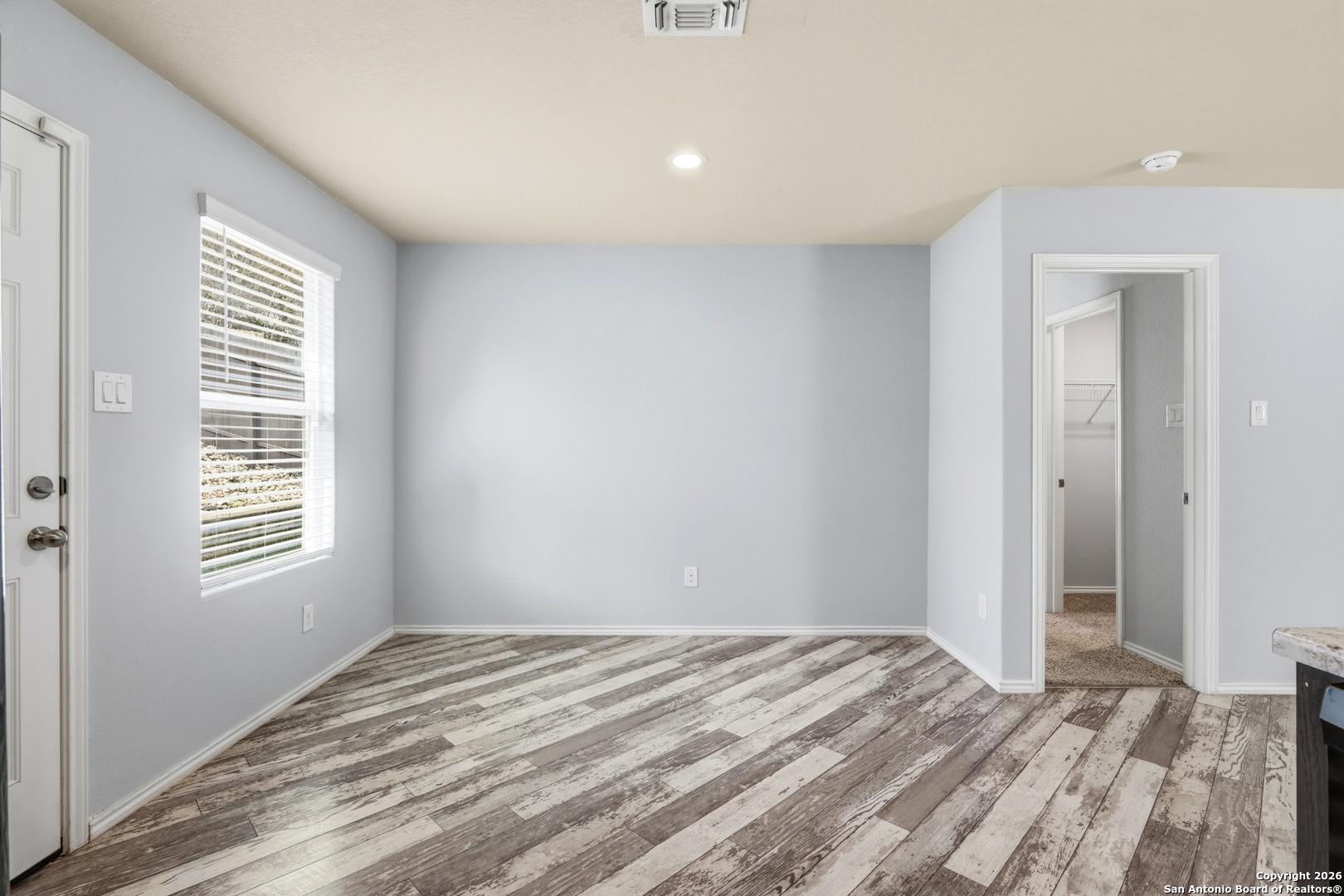 9713 Sandy Rdg Way San Antonio, TX 78239 - Photo 17 of 39 a view of empty room with wooden floor