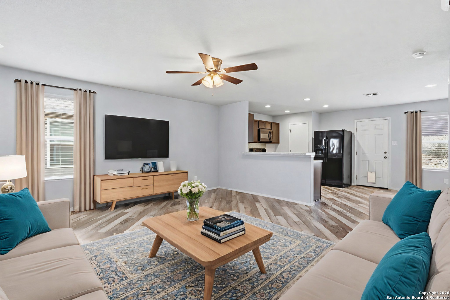9713 Sandy Rdg Way San Antonio, TX 78239 - Photo 2 of 39 a living room with furniture and a flat screen tv