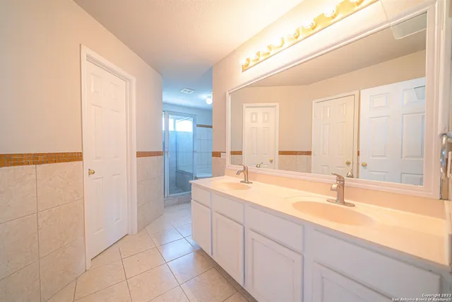 a bathroom with a bathtub and shower