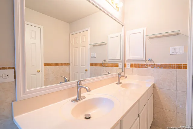 a balcony with potted plants and wooden floor