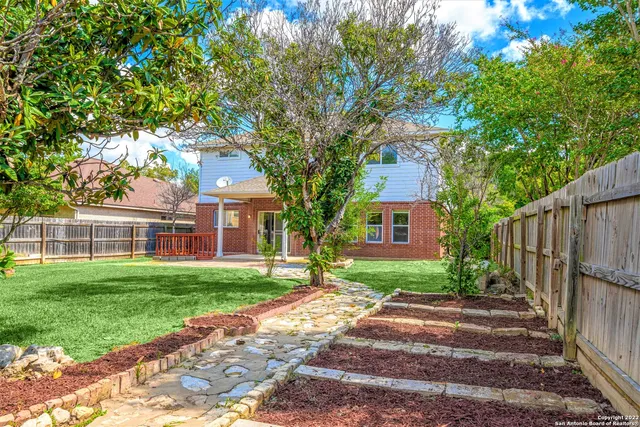 a view of a backyard with a garden