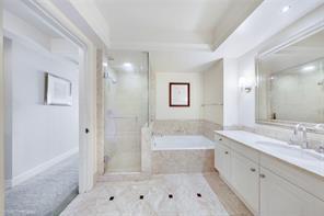 1435 Brickell Avenue, Unit 3211 Miami, FL 33131 - Photo 16 of 16 a bathroom with a bathtub shower and sink