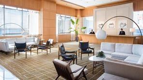 1435 Brickell Avenue, Unit 3211 Miami, FL 33131 - Photo 3 of 16 a living room with furniture a large window and a dining table